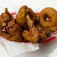 Chicken Wings · 6 wings - three drums, three flats. Includes a honey donut & your choice of two sauces.