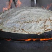 Plain Saj Bread · A very thin, large unleavened flatbread in Arab cuisine freshly baked on a convex metal grid...