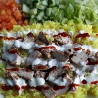 Beef/Lamb Rice Bowl · Middle Eastern cuisine consisting of beef and lamb cut into thin slices, stacked in a cone-l...