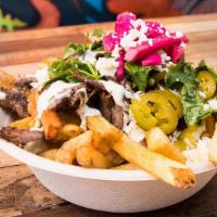 Beef/Lamb Loaded Fries · Middle Eastern cuisine consisting of beef and lamb cut into thin slices, stacked in a cone-l...