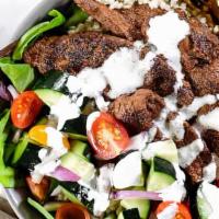 Beef/Lamb Salad Bowl · Middle Eastern cuisine consisting of beef and lamb cut into thin slices, stacked in a cone-l...