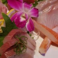 Sashimi Plate · Twenty pieces. Served with miso soup or house green salad.