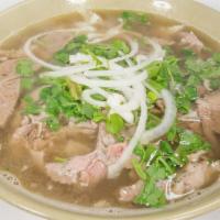 Beef Pho Special (Pho Bo Dac Biet) · Large bowl Pho includes rib-eye steak, beef brisket, and meatballs.  Garnished with onions a...
