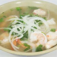 Seafood Pho (Hu Tieu Do Bien) · Seafood pho with shrimp & fish tofu.  Garnished with onion and cilantro.