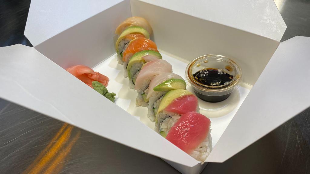 Rainbow1 · California roll with raw fish on top.

This item may contain raw or undercooked ingredients or may be cooked to order. Consuming raw or undercooked meats, poultry, seafood, shellfish, or eggs may increase your risk of food-borne illness.