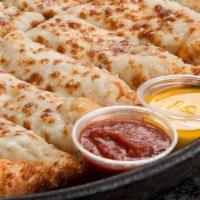 Cheese Stix · Handfuls of mozzarella baked on our scratch dough.