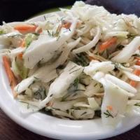 Coleslaw · Shredded cabbage and carrots in a creamy mayo dressing.