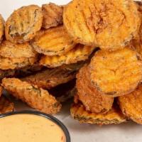 Fried Pickle Chips · House Cut, Breaded and Fried Pickle Chips With Chipotle Ranch Sauce.