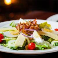 Cobb Salad · mixed greens topped with european cucumber, grape tomatoes, boiled egg,    red onion, bacon ...