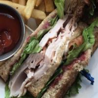 Turkey Club · traditional style turkey club on whole grain bread with hickory smoked bacon, lettuce, tomat...