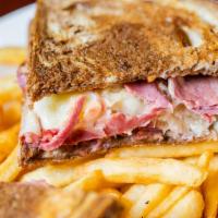 Reuben · a classic ... corned beef, piled high with sauerkraut, melted swiss cheese and thousand isla...