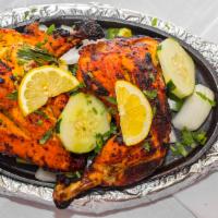 Chicken Tandoori · Spring chicken marinated in fresh spices and lemon, then barbequed over flaming charcoal in ...
