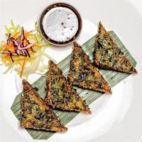Thai Pancake · Rice flour stuffed with scallions served with ginger sauce.