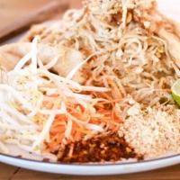 Chicken Pad Thai · Stir-fried rice noodles with egg, bean sprouts, scallions, and ground peanuts.