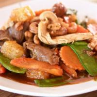 Pad Paradise · Sautéed beef, chicken, and shrimps with cashew nuts, red peppers, carrots, basil, snow peas,...