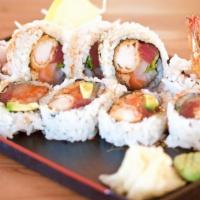 Hungry Dragon Roll · Shrimp tempura, avocado, eel, tuna, salmon, and white tuna served with spicy sauce and eel s...