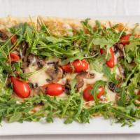 Kennett Square Mushroom · Baby arugula, heirloom cherry tomatoes, mozzarella, crispy leeks, truffle olive oil.