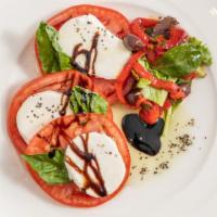 Caprese Salad · Heirloom tomatoes, fresh mozzarella, basil, balsamic reduction.