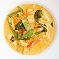 Red Curry · Choice of meat, broccoli, carrot, bell pepper, green bean, snow pea, and basil in Thai red c...