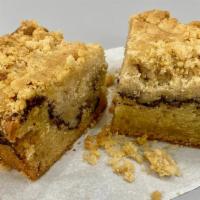 Classic Coffee Cake · Perfect pairing with any drink. Our classic coffee cake is a vanilla cake with cinnamon crum...