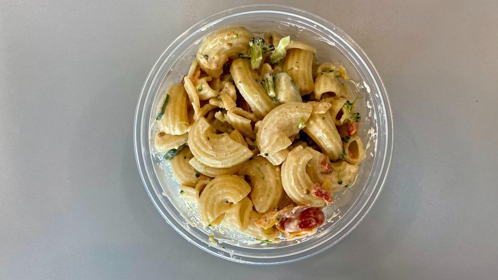 Pasta Salad (From Cheezy Vegan) · It's officially pasta salad season!  Cavatappi pasta with black olives, sun-dried tomatoes, grape tomatoes and diced cucumbers dressed in Chef Reeky's house creamy vinaigrette.