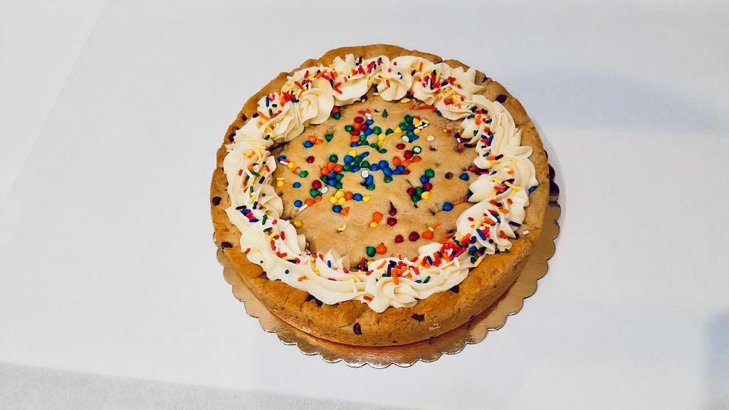 Magic Cookie Cake (9 Inch) · If you like our chocolate chip cookies, you'll love this 9 inch chocolate chip cookie topped with sprinkles and buttercream.