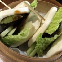Chashu Bao · Steamed buns stuffed with savory-sweet pork belly, cucumber and lettuce.
*Contains wheat