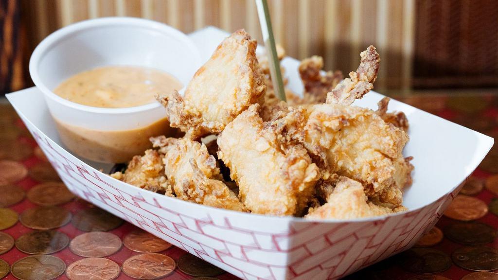 Karaage Chicken · Japanese-style popcorn chicken bites. Served with spicy mayo sauce.