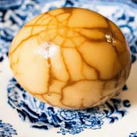 Marbled Tea Egg · A cage-free, hard-boiled egg slowly steeped in a soy-tea marinade.