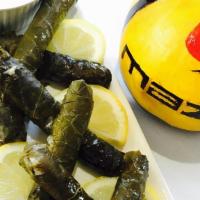 Stuffed Grape Leaves · Hand roll grape leaves stuffed with rice, meat, and spices.