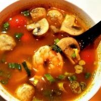 Tom Yum (Hot And Spicy Soup) · spicy sweet and sour soup with mushroom, tomato , scallion and cilantro