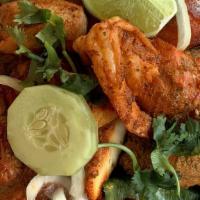Special Tandoori Mix Grill · Combination platter of tandoori ( chicken, shrimp, fish & lamb ).