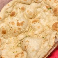 Garlic Naan · Bread stuffed with fresh minced garlic & herbs, baked in tandoor clay oven.