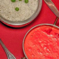 Chicken Tikka Masala · Breast meat chicken skewed in tandoor and sauteed in a rich creamy sauce topped with bell pe...