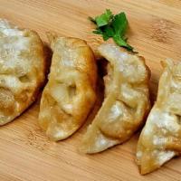 Gyoza Dumpling (5) · Steamed or Fried mixed chicken & vegetable dumpling, served with sweet ginger soy sauce.