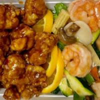 Dragon & Phoenix · Hot & Spicy. General Tso's chicken and white sauce jumbo shrimp joined in a Unique Matrimony.