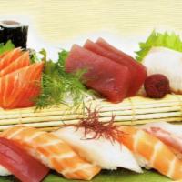 Sushi And Sashimi Combo · Six pieces sushi, 10 pieces sashimi and one tuna roll. Served with miso soup or salad.