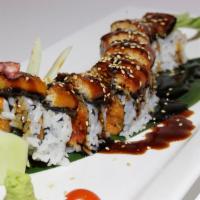 Dancing Eel Roll · Eight pieces. Spicy salmon, avocado and cucumber inside, top with eel and eel sauce.