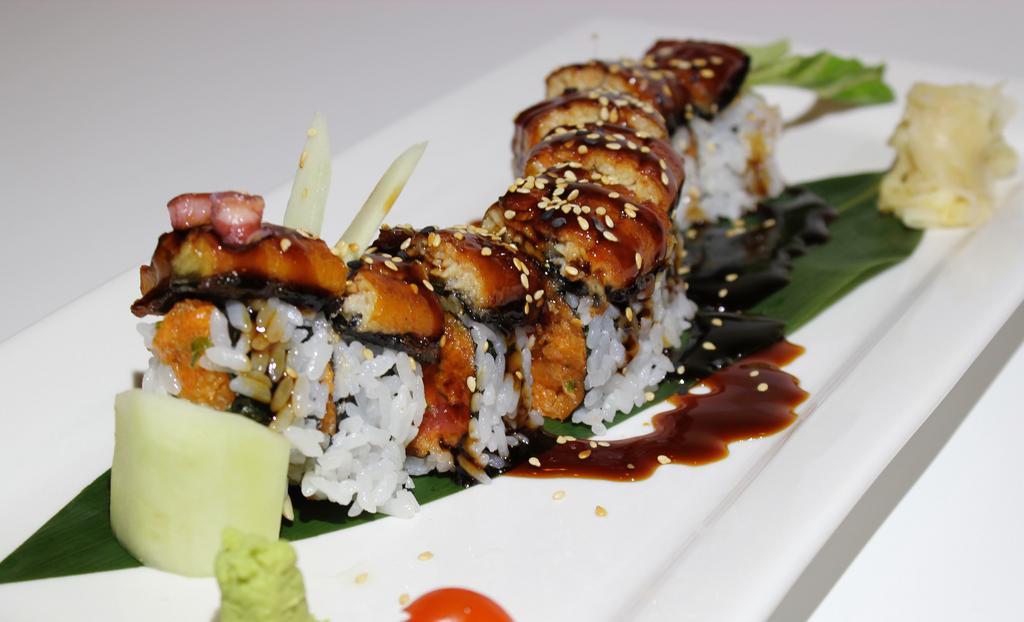 Dancing Eel Roll · Eight pieces. Spicy salmon, avocado and cucumber inside, top with eel and eel sauce.