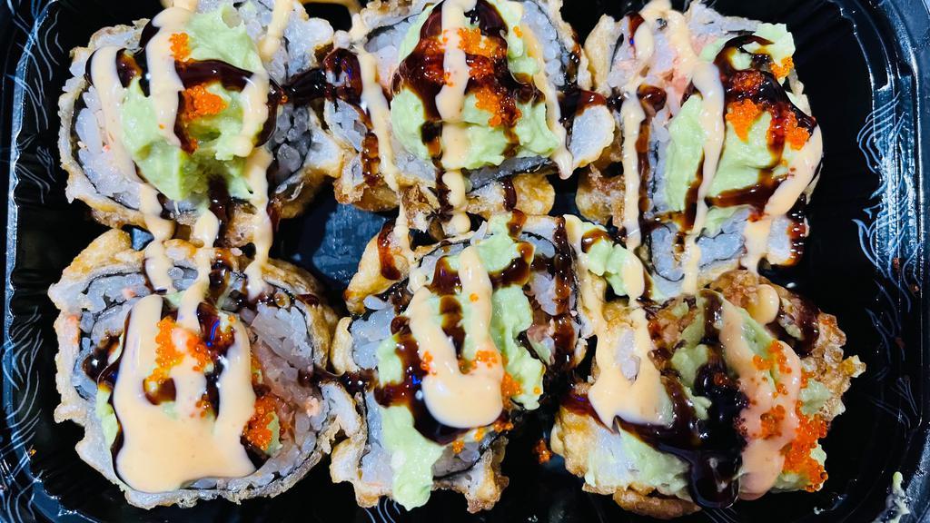 Volcano Roll · Six pieces. Spicy tuna, spicy crab inside deep fried, top with eel sauce and spicy mayo, avocado, lemon juice and tobiko.