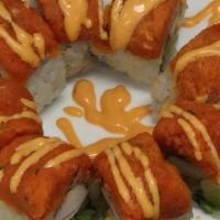 Red Sun Roll · Crabmeat, avocado and pineapple inside. Topped with spicy tuna and spicy mayo sauce.