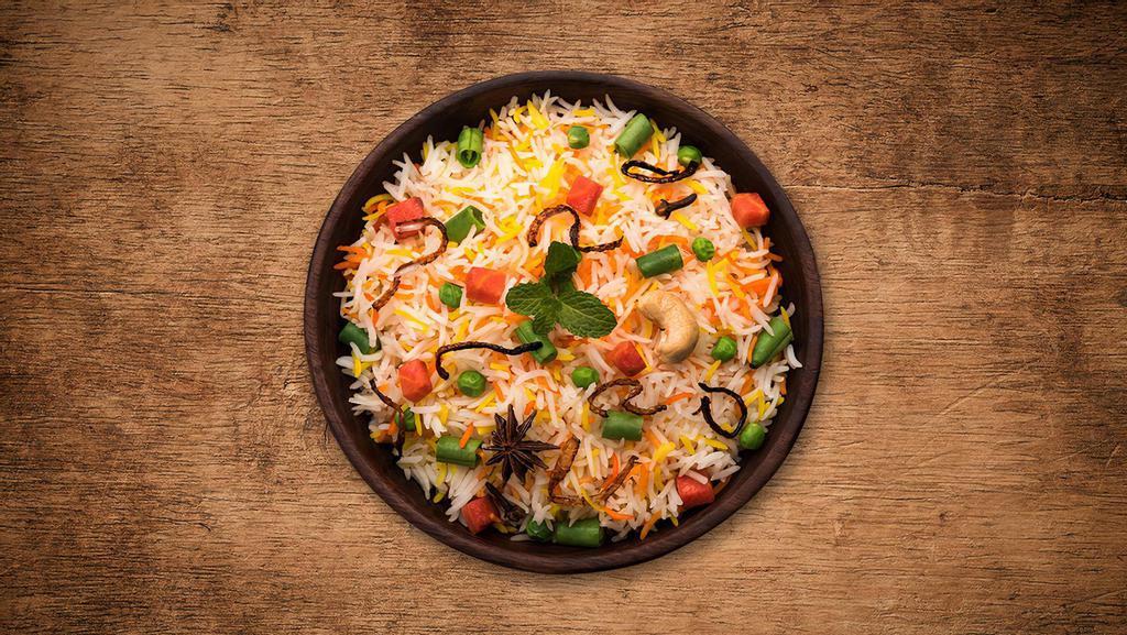 Yum Veggie Biryani · Fresh vegetables  cooked in our signature biryani masala gravy and long grain premium basmati rice with Indian biryani spices.
