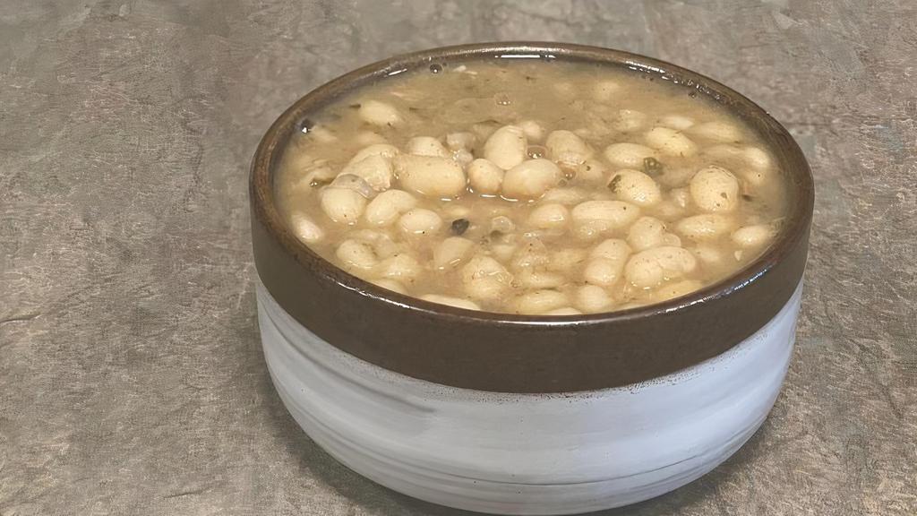 Organic Inti White Beans · slow simmered orangic white beans with sage & epazote