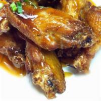 * Thai Spicy Wing · New item and mild. Fried wings with Thai spicy brown sauce topped with scallion and cilantro.