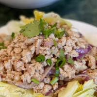 ** Larb Salad (Chicken, Pork Or Beef) · Hot. Chopped meat with red onion, mixed with spicy lime dressing, topped with cilantro and s...