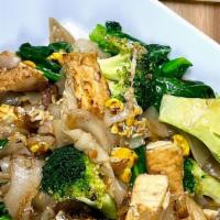 Pad See You · Stir-fried flat rice noodle with Chinese broccoli, broccoli, bean curd, and egg in sweet soy...