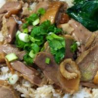 Roasted Duck On Rice · Roasted duck and steamed Chinese broccoli, topped with cilantro and scallion over rice, serv...