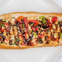 Chicken Cheesesteak Tuscany · Marinated and chopped Daring chicken (soy based) on a hoagie roll or wrap with vegan shredde...