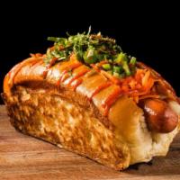 Banh Mi Dog · Signature dog topped with jalapeños, cucumber, pickled carrots, cilantro, sriracha mayo & sr...