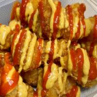 Haute Tots · topped with sriracha and curry ketchup